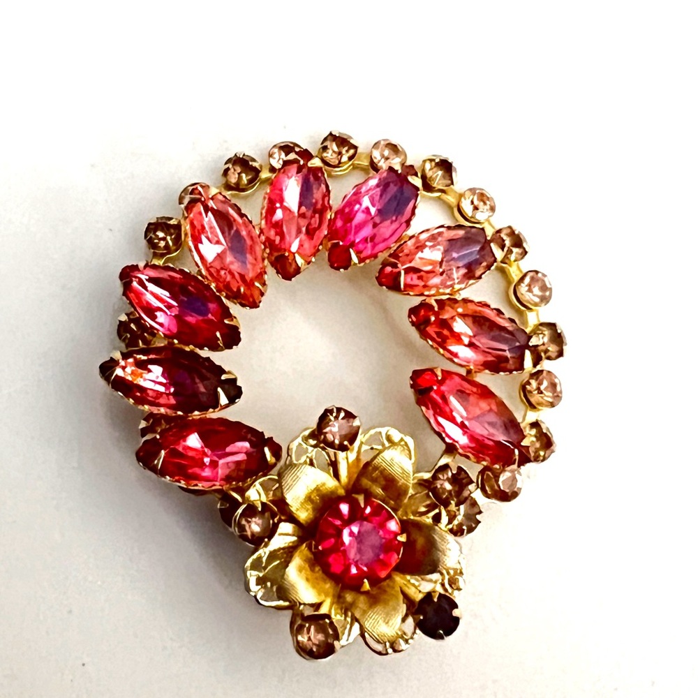 Pink and gold tone brooch unsigned